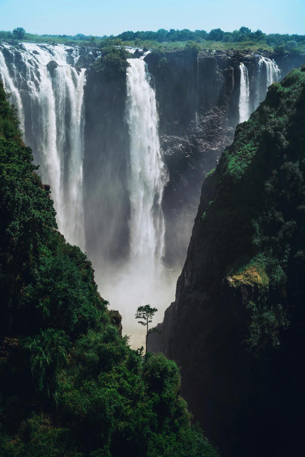 No description of Zambia is complete without its greatest natural icon: Victoria Falls, known locally as Mosi-oa-Tunya, meaning “The Smoke That Thunders.”